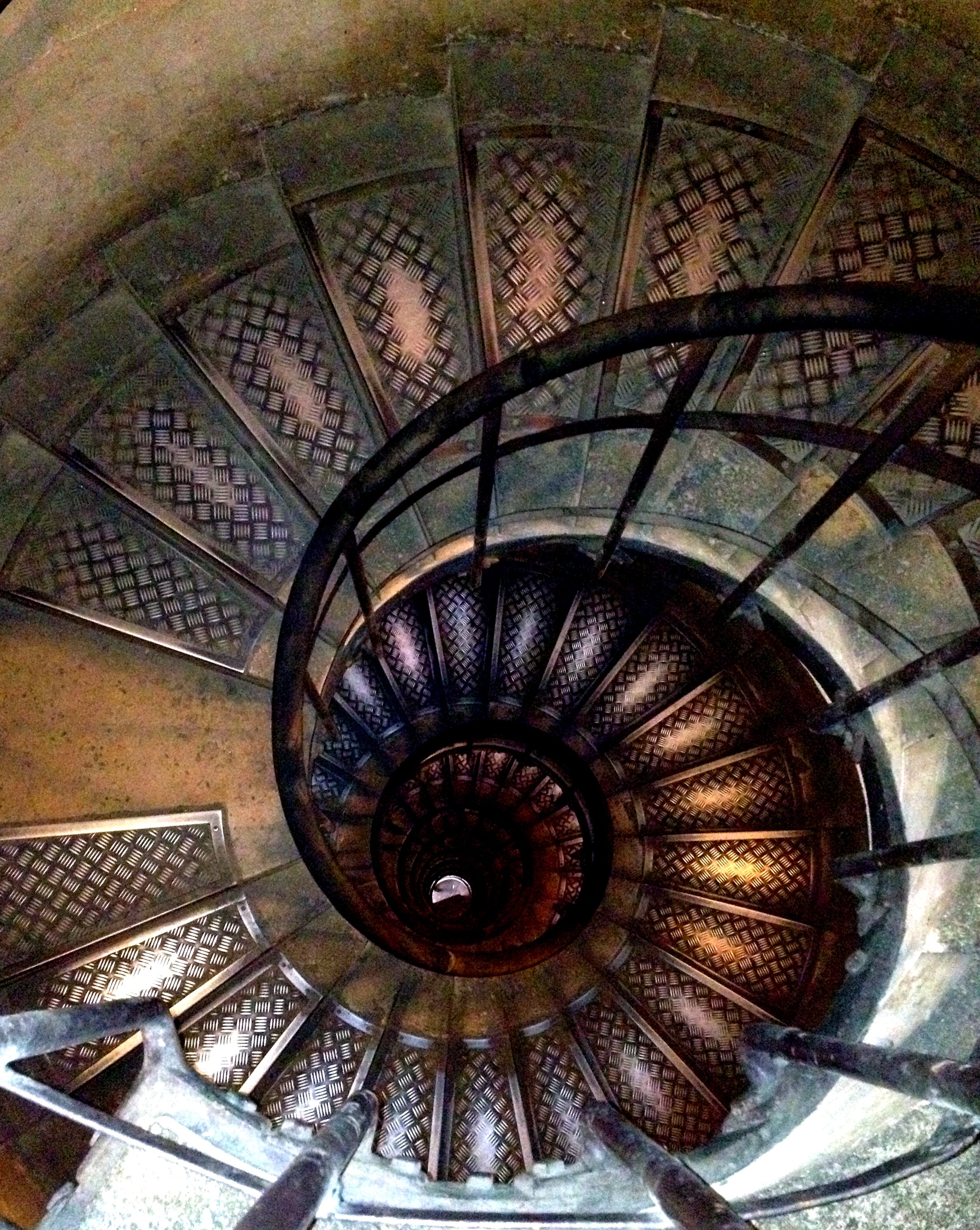 Spiral staircase interior looking up architectural detail
